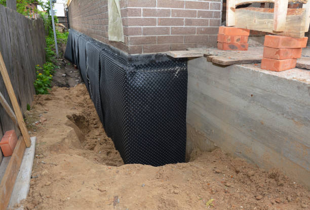 Happy homeowners after waterproofing job in Manchester